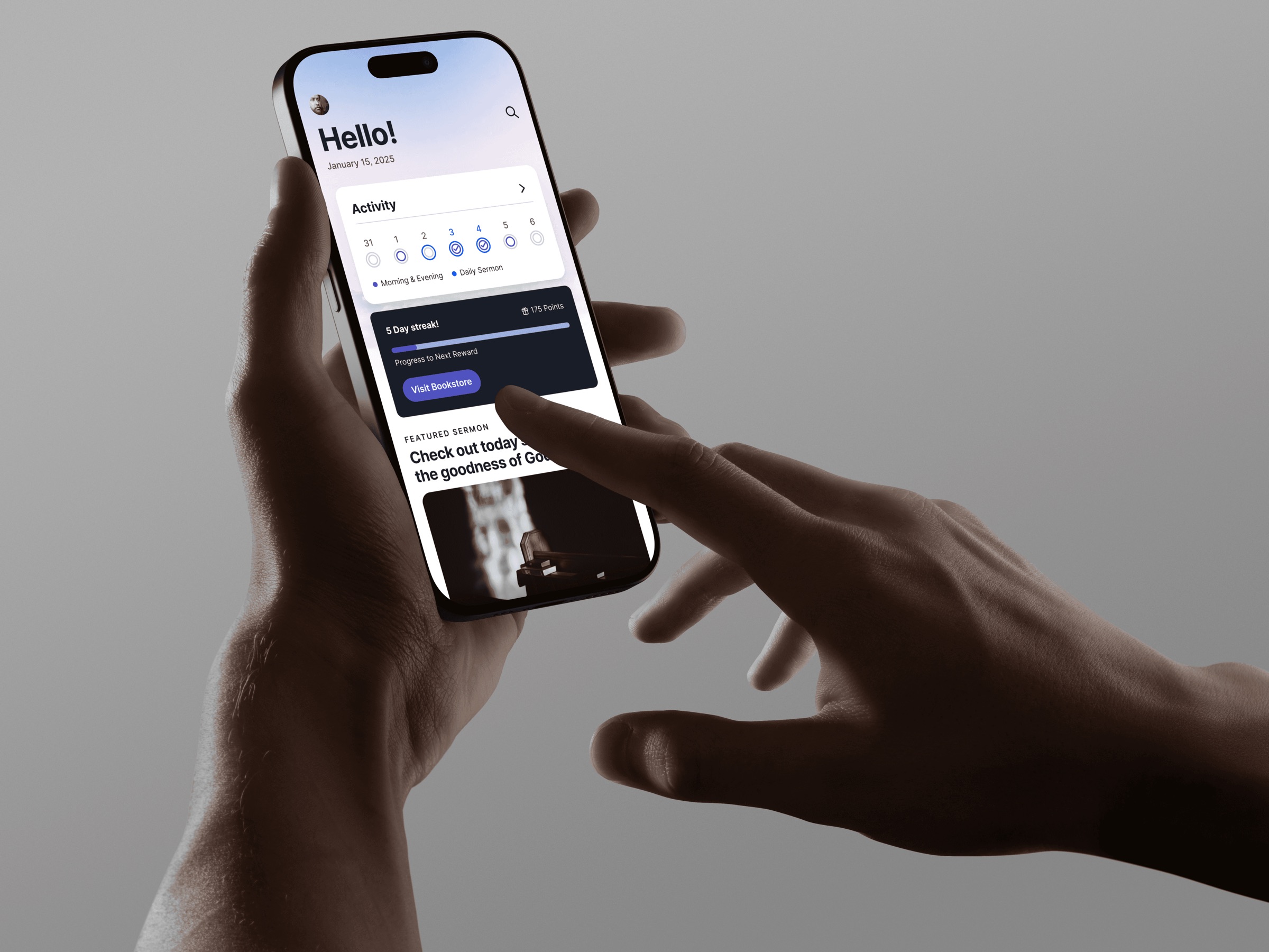 A hand holding a phone with the Spurgeon HQ app open